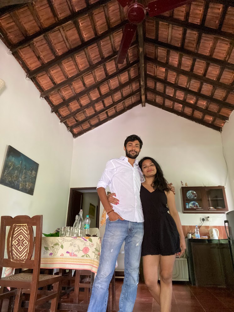 Anukshi and Shubhankar smiling on the beach in Goa, 2022